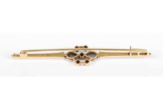 A gold backed, sapphire and diamond bar brooch, collet set with two pear shaped sapphires and five - Image 2 of 2