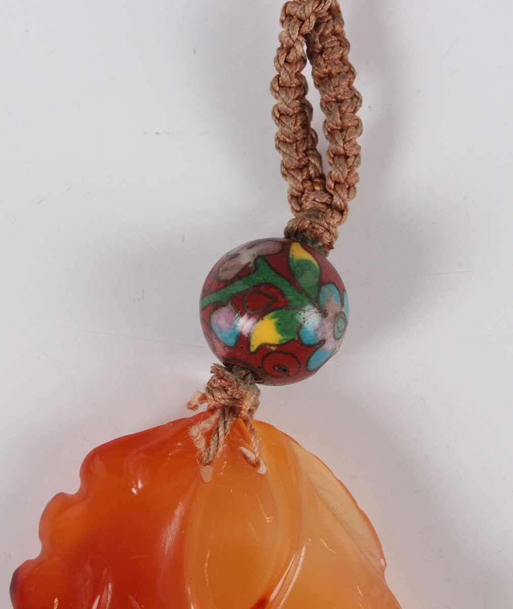 A Chinese carnelian pendant, 20th century, carved and pierced with squirrel, fruit and flowers, - Image 7 of 26