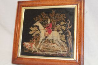 A 19th century needlework tapestry depicting a huntsman, horse and hounds in maple and gilt frame,