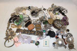 A large quantity of various costume jewellery including necklaces, bracelets, brooches,