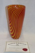 An art glass vase by Castellani with red and yellow striped decoration,