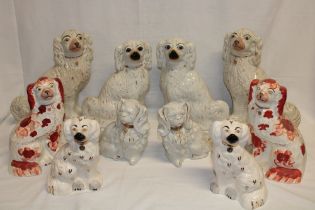 Five pairs of Staffordshire pottery seated spaniel figures in varying conditions