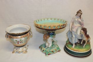 A Wedgwood majolica glazed circular comport with cherub decorated stem and rustic base 9" high (af);