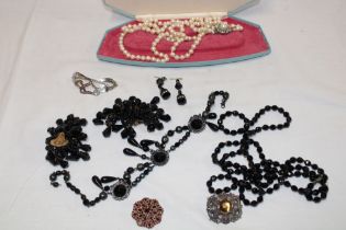 A selection of various jet jewellery, silver brooch and various other costume jewellery etc.