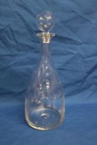 An unusual high quality magnum-size cut-glass decanter with star cut decoration and stopper,
