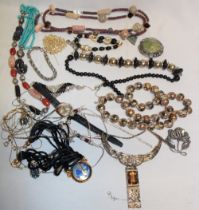 A selection of various costume jewellery including necklaces, brooches etc.
