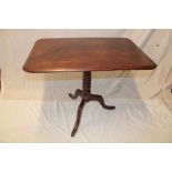 A 19th century mahogany rectangular snap-top occasional table on turned column with tripod base