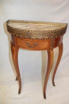 A reproduction French semi-circular side table with inset marble top,