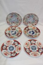 Three pairs of 19th century Japanese Imari pottery circular plates with painted bird and floral