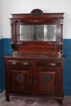 A Victorian Art Nouveau walnut sideboard with mirror back,