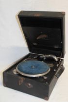 An old portable gramophone by Crescendo in black fibre case
