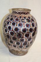 An old Eastern-style tapered vase with painted decoration,