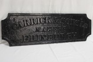 An old cast-iron rectangular Maker's plaque from a gantry crane "J.