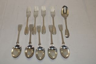A set of six Victorian silver fiddle pattern dessert spoons with engraved crests,