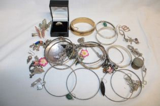A quantity of various costume jewellery including bangles, necklaces, dress rings etc.