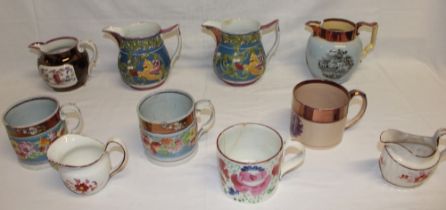 A selection of 19th Century copper lustre pottery including a pair of relief decorated jugs,