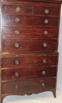 A George III mahogany chest on chest, the base with three long graduated drawers and brushing slide,