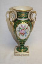 A French Paris porcelain two-handled baluster-shaped vase with painted floral panel on gilt and