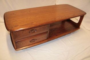 A 1960s Ercol medium elm rectangular coffee table with two small drawers and open recess,