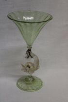 A Venetian glass ornamental goblet-shaped vase with dolphin decorated stem,