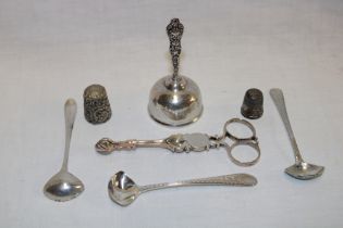 A pair of good quality silver sugar tongs with scallop terminals, three silver condiment spoons etc.