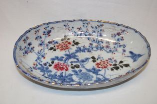 A 19th century Japanese china oval bowl with painted bird and floral decoration,