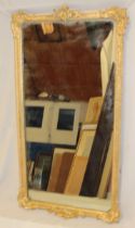 A good quality rectangular wall mirror in scroll decorated gilt frame,