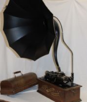 An Edison Home phonograph in domed oak case together with original horn,