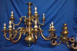 A good quality brass twelve-branch ceiling chandelier with scroll supports,