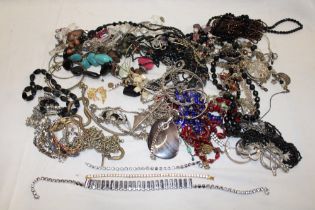A large selection of various costume jewellery including necklaces, brooches, bracelets,