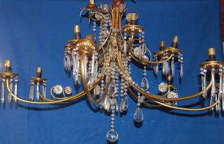 A good quality brass fourteen branch ceiling chandelier with glass lozenge droplet decoration,