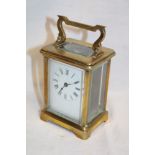 A French carriage clock with rectangular enamelled dial in brass traditional glazed case