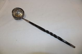 A 19th century silvered toddy ladle with raised decoration,