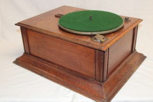An old oak cased table-top gramophone