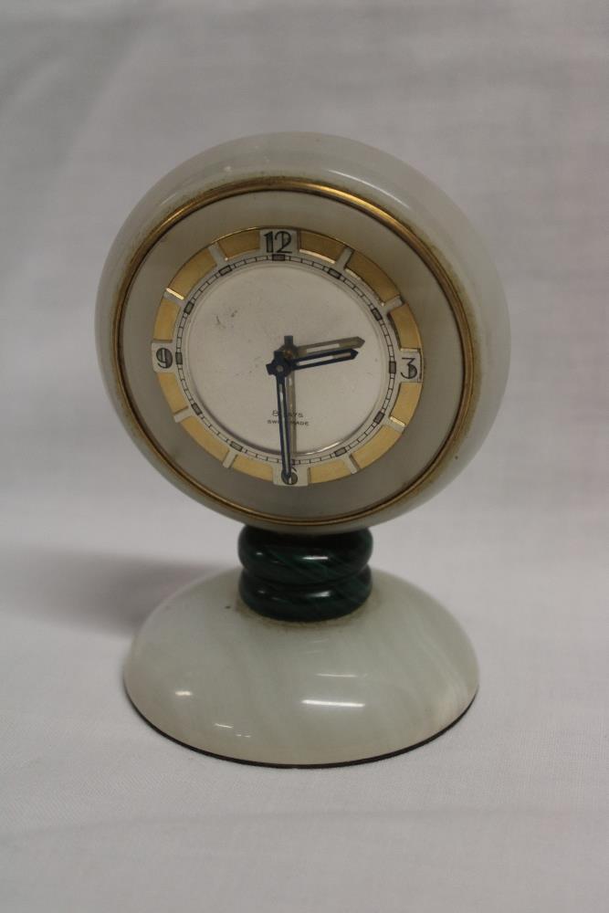 A 1960's/70's eight day desk clock in polished marble and malachite case