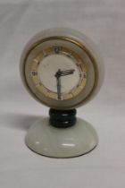A 1960's/70's eight day desk clock in polished marble and malachite case