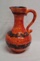A 1960's pottery tapered jug with silver and orange glazed decoration,