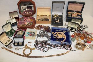 A selection of various costume jewellery including cuff links, necklaces etc.