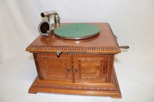 An old French table-top gramophone by Pathe in carved walnut case