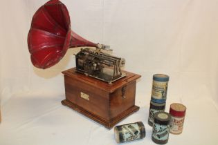 An unusual Cleopatra Reproducer Phonograph in walnut fitted case together with metal horn and a