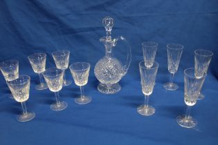 A set of six Waterford cut-glass wine goblets with tapered stems and circular bases,