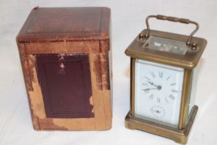 A French carriage clock with rectangular enamelled dial in brass traditional glazed case and