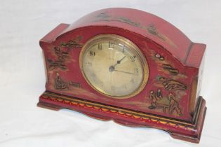 A 1930's/40's mantel clock by Asprey with gilt circular dial in red lacquered chinoiserie arched