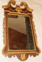 A good quality Regency-style gilt and mahogany rectangular wall mirror with raised scroll