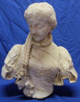 A large old carved marble bust of a female,