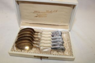 A set of six Swiss silver tea spoons with decorated handles in lined makers case