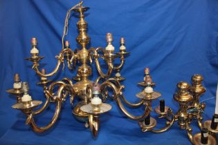 A good quality brass twelve branch ceiling chandelier with scroll supports,
