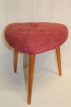 A 1960's Ercol triangular dressing stool with fabric upholstered seat