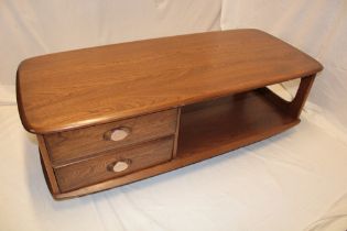 A 1960's/70's Ercol light/medium elm rectangular coffee table with two small drawers and an
