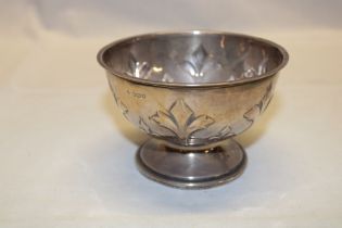 A George V silver circular pedestal bowl with raised leaf decoration, 4½" diameter,